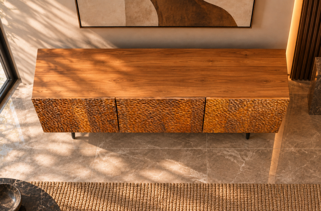 Elevated view of the Lunar Spec bar cabinet, showing a wide top with visible wood grain, three textured doors in a warm brown finish and slim dark legs.