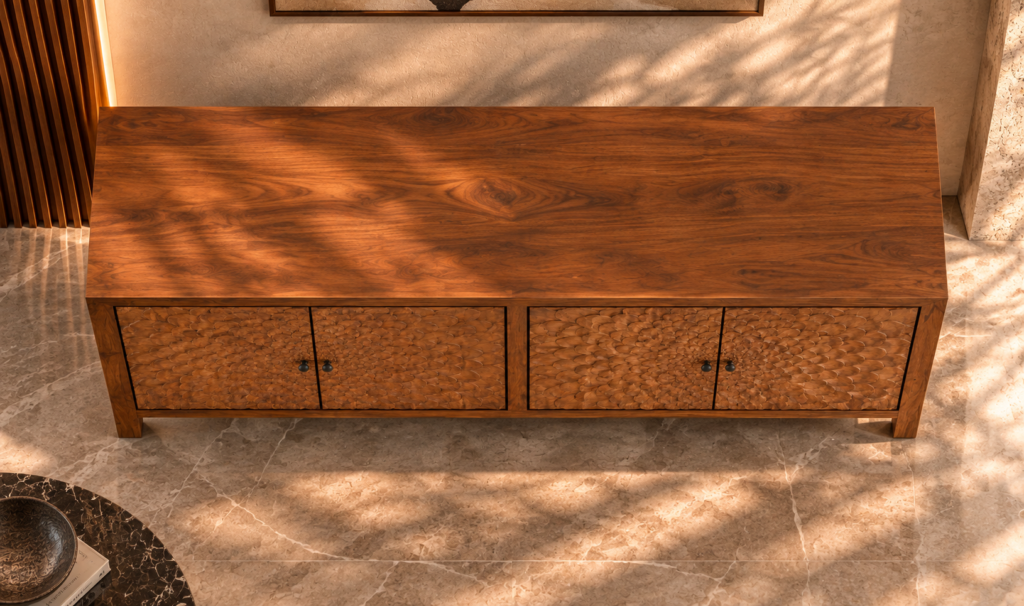 Elevated view of the Rosette bar cabinet in a warm brown wood finish, with a broad grained top, four doors forming two floral patterns, dark round knobs and short square legs.