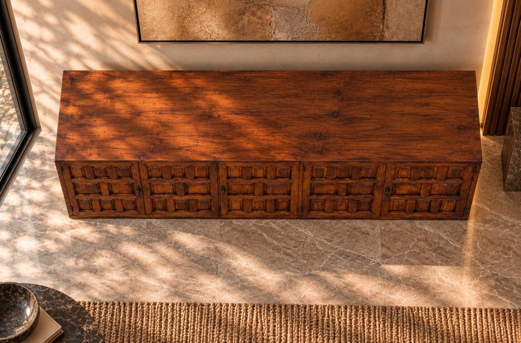 Elevated view of the Porticco bar cabinet in a warm brown wood finish, showing a wide grained top, doors with square and rectangular panel detailing, dark handles and exposed hinges.