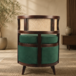 Rear view of the BASSELINE chair with a dark-finished acacia wood frame, wraparound cane back and deep green upholstered body.