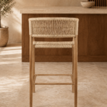 Rear view of the BAR GARDENIA chair with a natural-finished acacia wood frame, handwoven rope back and matching woven seat.