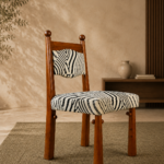 ZEBRONA acacia wood chair with a black-and-ivory zebra-pattern upholstered seat and backrest.