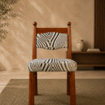 Front view of the ZEBRONA acacia wood chair with a black-and-ivory patterned upholstered seat and backrest.