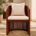 Front view of the Harmonica chair with a dark brown cord-wrapped frame, vertical strand detailing and ivory upholstered cushions.