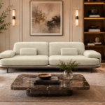 Front view of the Continentale sofa in ivory Aston 902 upholstery, with two broad seats, padded arms, rectangular lumbar cushions and slim dark legs.