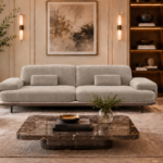 Front view of the Continentale sofa in light beige Aston 924 upholstery, with two broad seats, wide padded arms, rectangular lumbar cushions and a slim brown base.