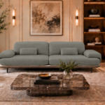 Front view of the Continentale sofa in grey-green Phantom 124 leatherette, with two broad seats, rectangular lumbar cushions, padded arms, a teak finish base and slim dark legs.