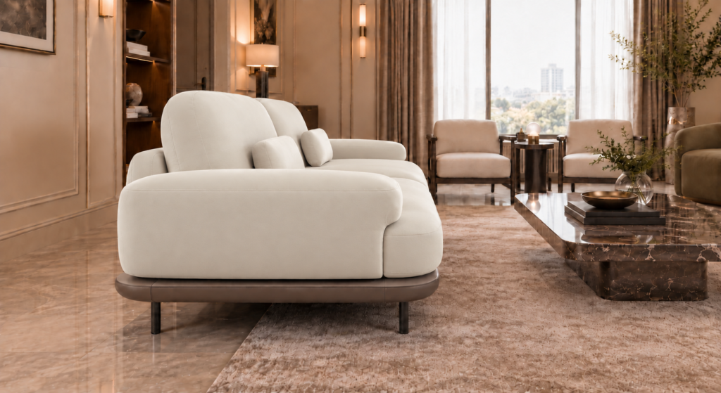 Side view of the Continentale sofa in ivory Phantom 102 leatherette, with a wide padded arm, deep seat, teak finish base and slim dark legs.