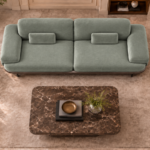 Top view of the Continentale sofa in sage-green Aston 922 upholstery, with two broad seats, wide padded arms and matching rectangular lumbar cushions.