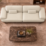 Top view of the Continentale sofa in ivory Phantom 102 leatherette, with two broad seats, wide padded arms, rectangular lumbar cushions and a teak finish base.