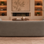 Rear view of the Formosa sofa upholstered in Giza 109 fabric, showing its continuous curved back, rounded ends and low-profile base.