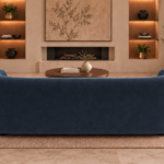Rear view of the Formosa sofa upholstered in deep blue Giza 114 fabric, showing its continuous curved back, rounded ends and low-profile base.