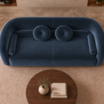 Top view of the Formosa sofa in deep blue Giza 114 upholstery, with a rounded wraparound back, two circular cushions and cylindrical side bolsters.