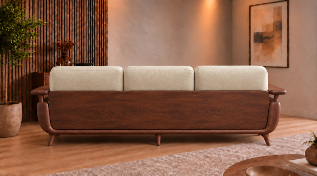 Rear view of the Grand Turismo Dark Wood sofa, featuring three cream patterned back cushions, a broad dark brown wooden panel with visible grain, rounded armrests and tapered legs.