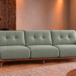 Front view of the Grand Turismo Dark Wood three-seater sofa in grey-green Phantom 118 leatherette, with rectangular backrest stitching, broad wooden armrests, curved side panels and tapered legs.