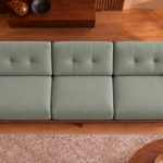 Overhead view of the Grand Turismo Dark Wood sofa in grey-green Phantom 118 leatherette, showing three equal seat cushions, rectangular backrest stitching, broad wooden armrests and a rounded dark brown frame.
