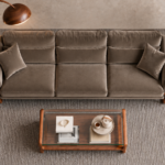Top view of the Madeira three-seater sofa in taupe patterned Amy 908 upholstery, showing three separate seats, horizontally divided back cushions, two matching pillows and padded arms with exposed teak finish frames.