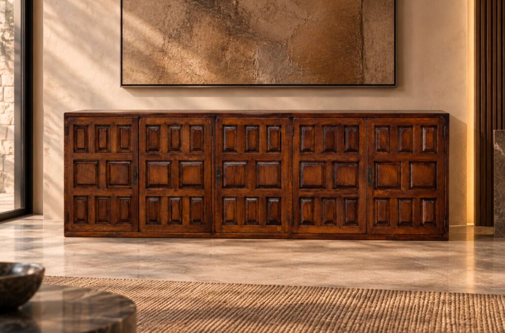 Front view of the Porticco bar cabinet in a warm brown wood finish, featuring five panelled doors, repeating square and rectangular details, dark decorative handles, exposed hinges and a low base.