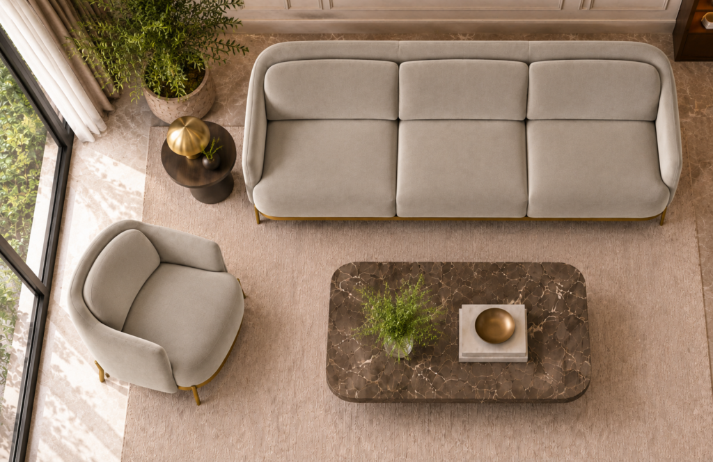 Top view of the Duet three-seater sofa and matching armchair in light beige patterned Aston 924 upholstery, showing aligned seat and back cushions, curved arms and gold finish base trim.