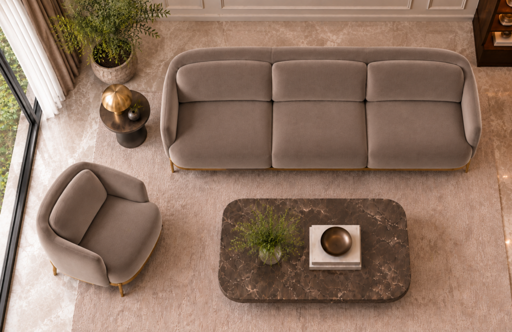 Overhead view of the Duet three-seater sofa and matching armchair in taupe patterned Aston 925 upholstery, with separate seat and back cushions, curved upholstered frames and slim gold finish base trim.